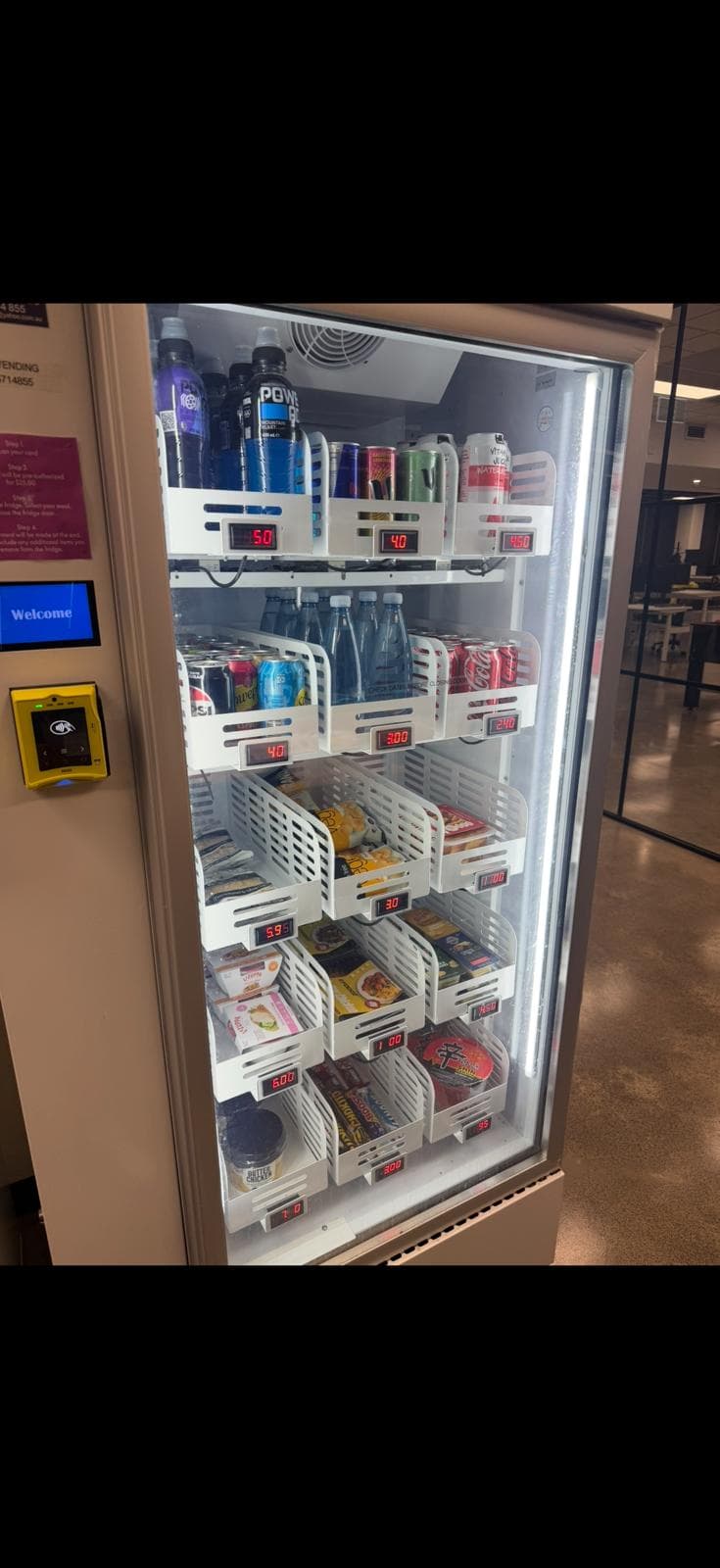 Smart fridge vending machine stocked with drinks, snacks and meals